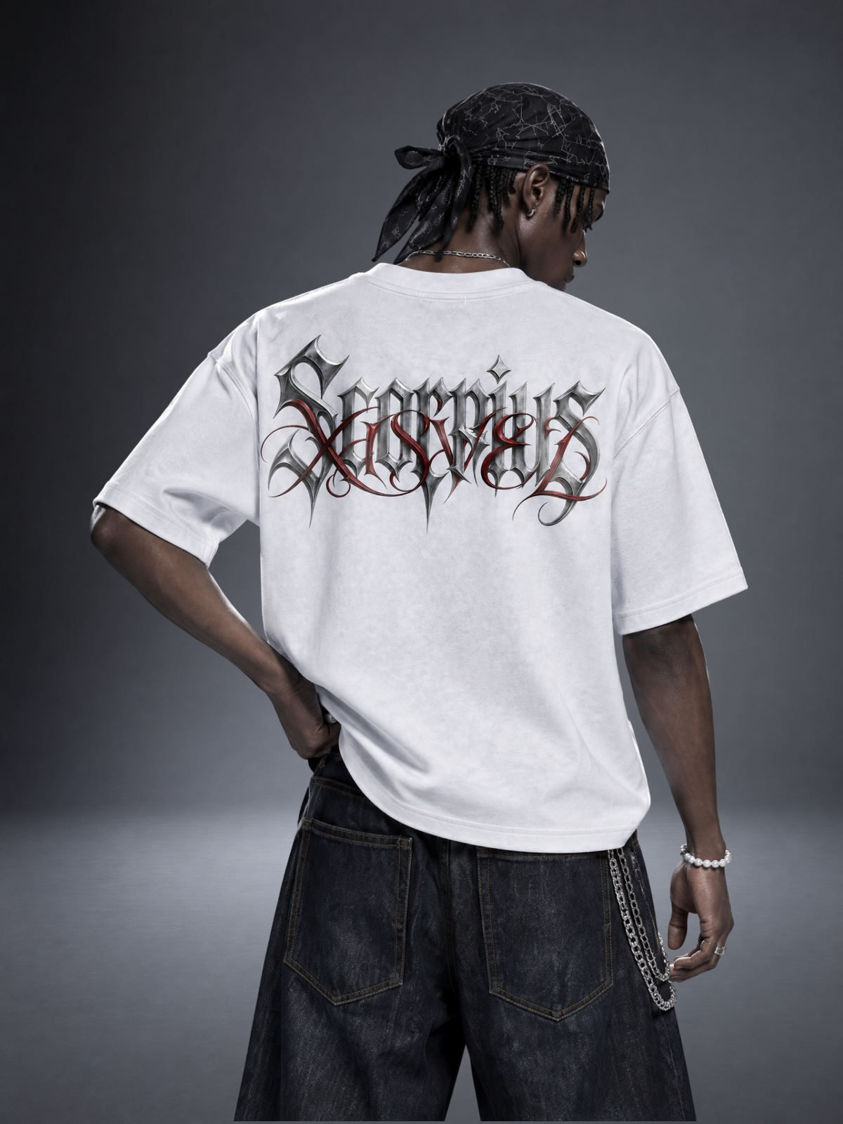 Scorpio zodiac white graphic tee - gothic 'Scorpius' lettering with red XISVEL script across the back