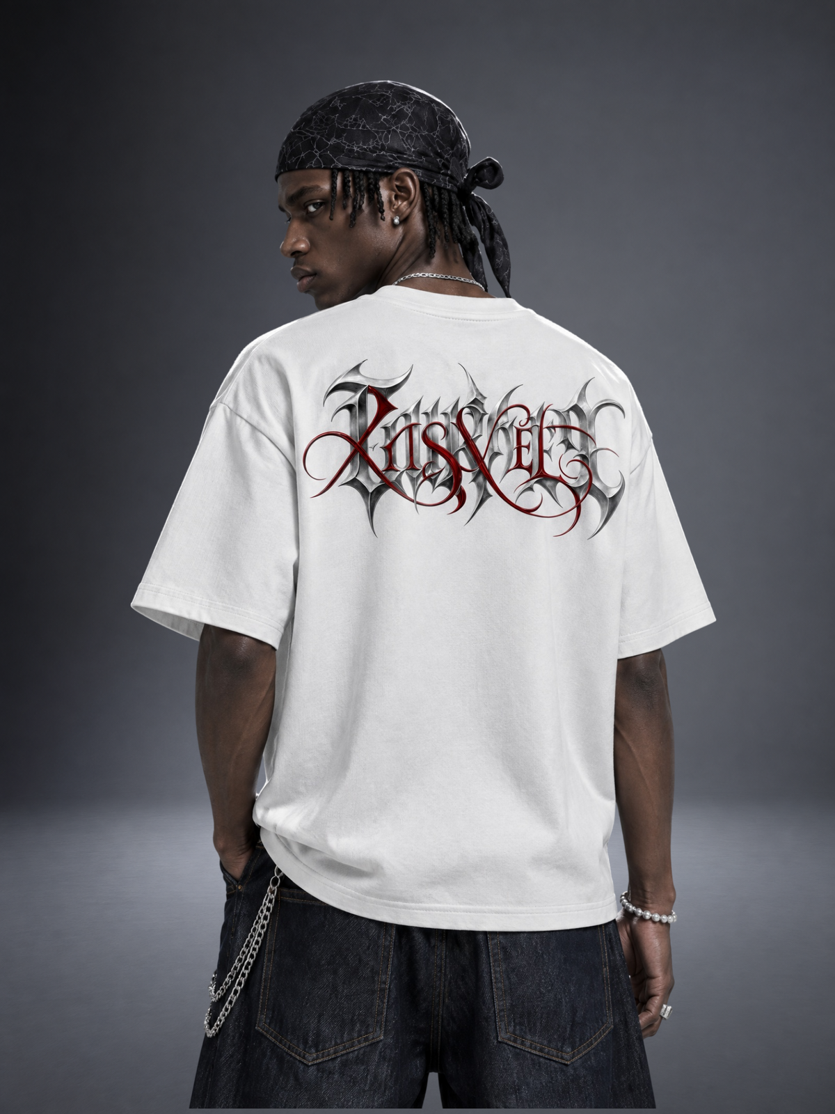 Taurus zodiac white graphic tee - gothic 'Taurus' lettering with red XISVEL script across the back
