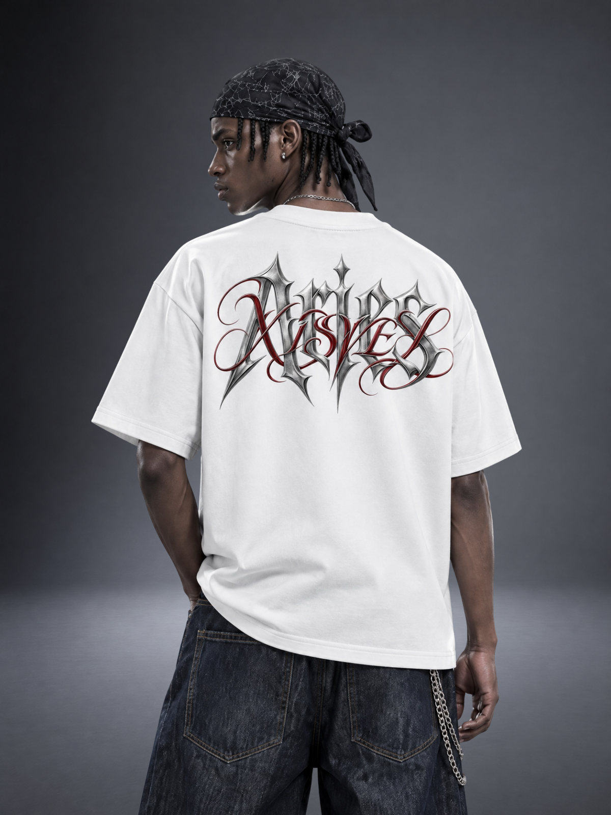 Aries zodiac white graphic tee - gothic 'Aries' lettering with red XISVEL script across the back