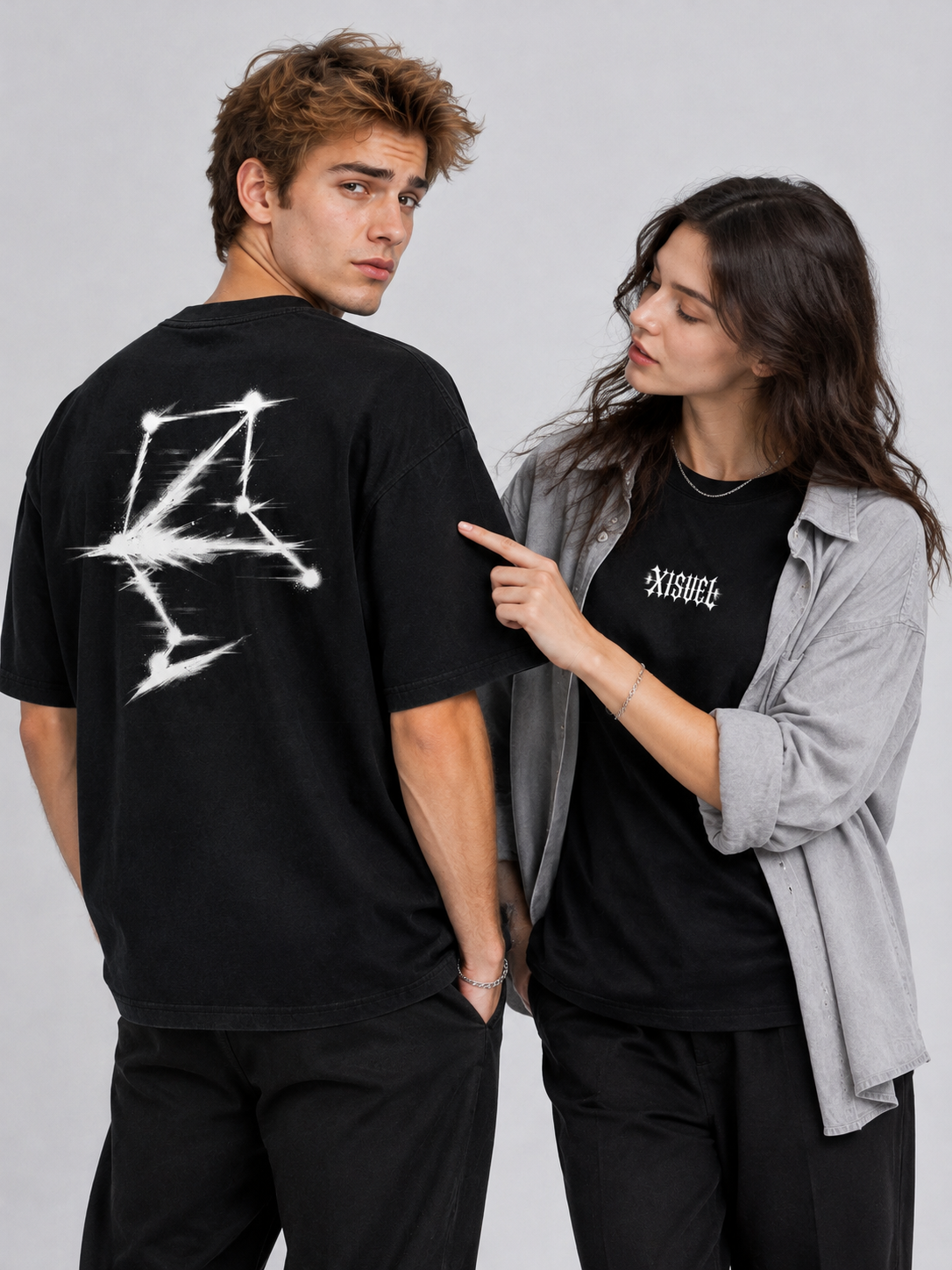Couple styling the black Libra Dark Graphic Tee, one showing the constellation back print