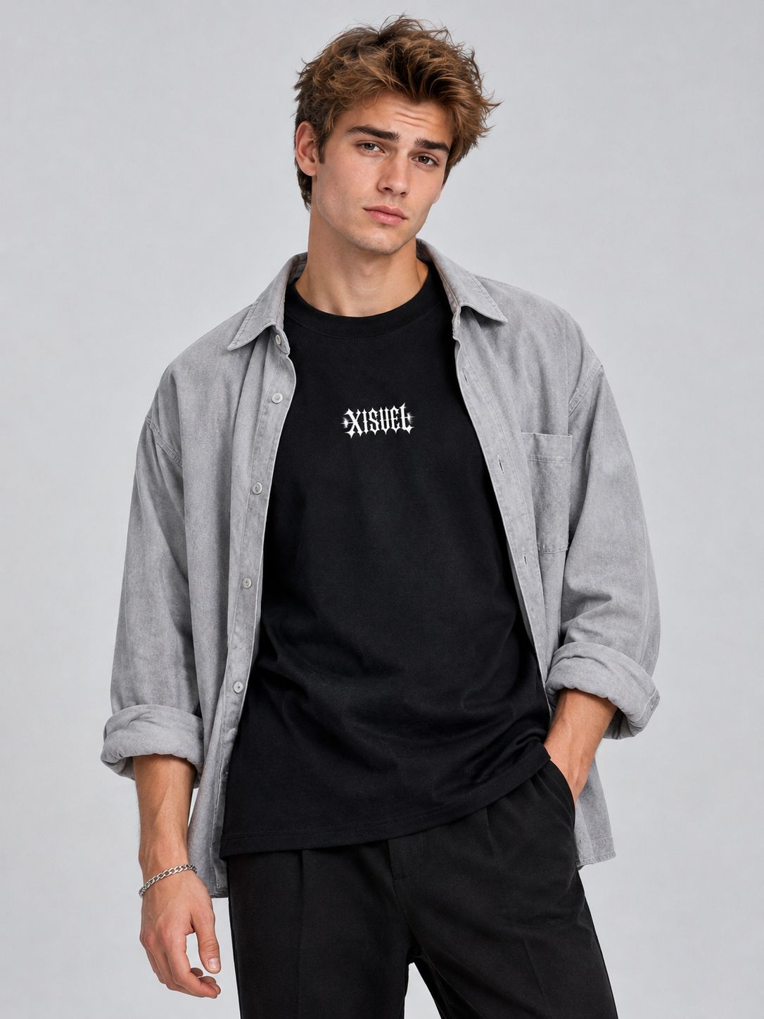 Male model in an open gray overshirt wearing the black Libra Dark Graphic Tee with gothic XISVEL chest logo